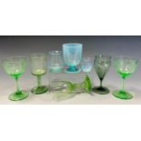 A 19th century poppy bowl liqueur glass, indented green tinted bowl, plain stem, textured foot, 13cm