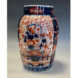 A Japanese fluted ovoid vase, painted in the Imari palette, 25cm high, Meiji period
