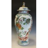 A large 19th century baluster vase, painted in polychrome enamels and gilt with flowers, prunus,