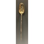 A George II silver mote spoon, pierced shell bowl, pointed terminal, 14.2cm long, indistinctly