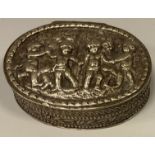 A late 19th century oval snuff box, embossed with cavorting Cherubs, unmarked white metal, 5.6cm x