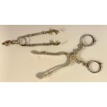 A pair of Georgian silver scissor action sugar nips, marks worn, London, c.1755; a pair claw nips (