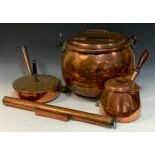 Copper - A 19th century copper lidded cauldron, riveted iron work, brass claw feet, with handle,