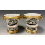 A pair of late 18th century Spode cachepots and stands, painted with ruins and Rural landscapes in