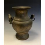 A large Japanese bronze ovoid vase, chased with scrolls chrysanthemums and trellis, the handles cast