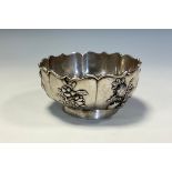 A Chinese silver lotus shaped pedestal bowl, applied with panels of persimmon, pomegranate,