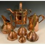 A 19th century planished copper jug, impressed X 794, 22cm high; three ale or wine funnels, 11cm and