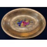 A Royal Worcester oval dish, decorated by J Smith, signed, painted with ripe fruit on a mossy bank