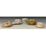 A group of three Wileman and Company tea cup trios; a 'Thistle' pattern, no.7018, snowdrop-shaped