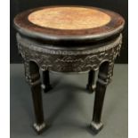 A 19th century Chinese hardwood fish bowl stand, circular top with inset soapstone panel, above a