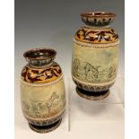 A pair of Doulton Burslem vases, decorated in scrafito by Hannah Barlow, typically decorated with