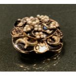 A Victorian diamond and seed pearl mourning brooch, the lobed double layered black and gold body