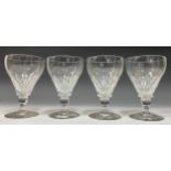 A set of four early Victorian rummers, the funnel-shaped bowls engraved with three rows of printies,