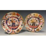 A pair of slightly graduated 19th century Imari pattern plates, probably Spode, decorated in a