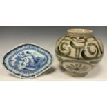 A 19th century Chinese blue and white dish, quatrefoil shaped, painted with pagodas and boats within