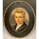 Edwardian school, Portrait of a young boy, oil on board, oval, 35cm x 28cm.