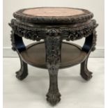 A Chinese hardwood fish bowl stand or table, shaped circular top with inset soapstone panel enclosed