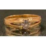 A Victorian diamond solitaire ring, oval old cut diamond approx 0.40ct, V claw shoulders, tapering