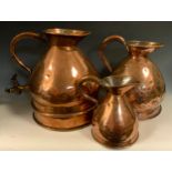 A large Warner's of London 2 Gallon copper ale jug, haystack form, part planished finish, brass T
