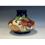 A Moorcroft Anna Lily pattern compressed ovoid vase, designed by Nicola Slaney, 16.5cm high,