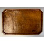 Martin Dutton, Lizardman of Huby - an oak rounded rectangular tray, dished border, adzed, carved