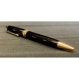 Mont Blanc- a Meisterstruck gold coated black ball point pen, with white Mont Blanc emblem to lid,