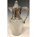 A 19th century Continental silver mounted wrythen ovoid claret jug, the hinged cover, mount and