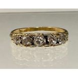A diamond ring, linear set with five graduated old cut diamond total estimated diamond weight approx