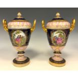 A pair of 19th century Vienna porcelain covered twin handled urns and covers, each painted with oval