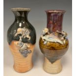 A Japanese Sumida Gawa vase, by Ishiguro Koko, deep green drip glaze on a raw stoneware body,