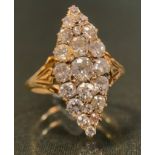 A navette diamond cluster ring, encrusted with twenty one old cut mixed shaped diamonds, largest