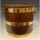 A George III brass bound bucket, oval drop loop handles, 32.5cm high, 40cm diameter
