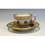 A Royal Worcester reticulated cup and saucer, attributed to George Owen, the saucer 11cm diam,