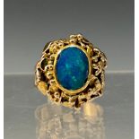 An blue green opal ring, the opal approx 10mmx 7mm, flashing strong blue, green and violet colour