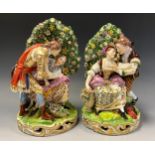 A pair of Continental porcelain figure groups in the Derby style, as seated ladies and companions