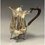 An Edwardian silver water jug, ebony handle, 18cm high, Walker & Hall, Sheffield 1902, 10.5ozt gross