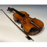 A 19th century violin, 37cm two piece back, label inscribed Antonio Stradivarius Made in Germany,