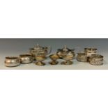 An assortment of silver including; a George V silver mustard pot,Birmingham, 1918; a pair of