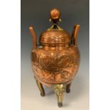 A 19th century Chinese copper and brass globular urn and cover as a tripod censer, the copper twin