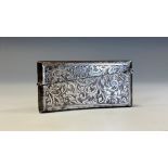 An Edwardian silver curved rounded rectangular visiting card case, engraved overall with scrolling