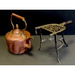 A 19th century copper kettle, wrought iron trivet stand
