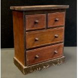 An early 20th century miniature stained pine chest, rounded over sailing top above two short over