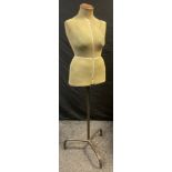 A 1940s Singer Tailors mannequin, female torso in green, telescopic tripod stand, approx 150cm high