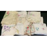 Hand embroidered linen tablecloths, including Crinoline Lady, English Country Garden flowers; others