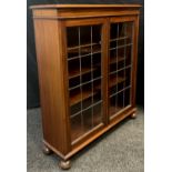 An early 20th century mahogany china cabinet, pair of gale de, leaded doors, enclosing three tiers