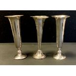 A pair of silver trumpet form bud vases, weighted bases, S Blanckensee & Son Ltd, Birmingham 1923;