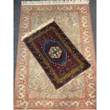 A Middle Eastern silk and wool mix rug / carpet, lotus-form medallion, within a field of stylised