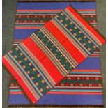 A large Greek flat-weave rug, knotted in bright blue, red, orange, and black 242cm x 191cm; another,