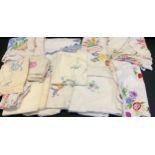 Hand embroidered linen tablecloths, including Crinoline Lady, English Country Garden flowers; others