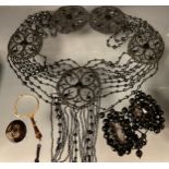 A Victorian Jet style lace and black bead fringe necklace composed of five floral roundels, mutli